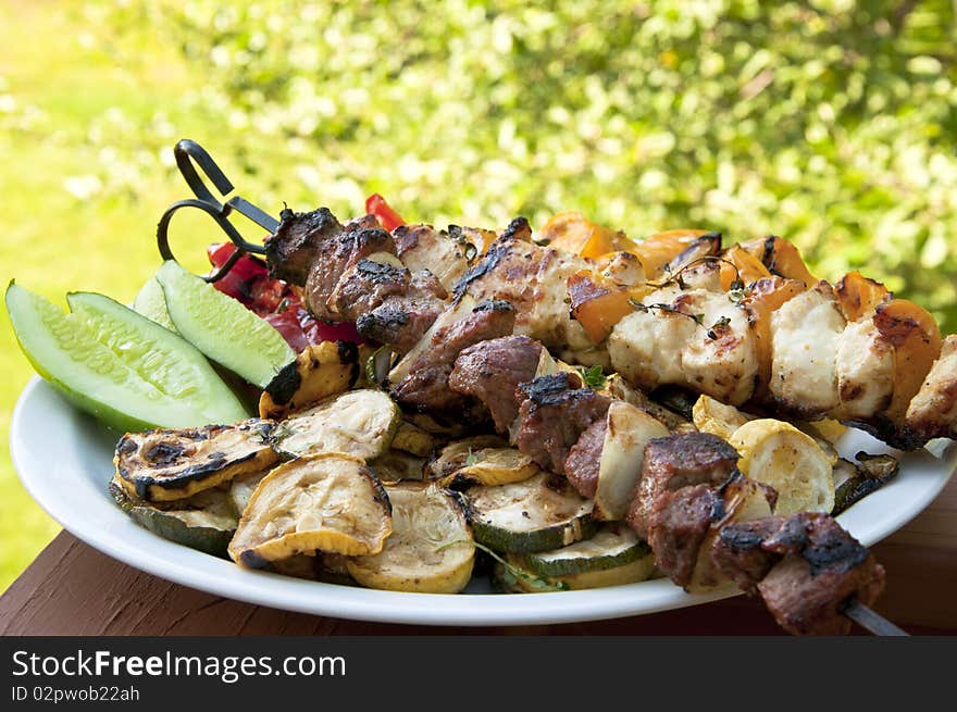 Summer delicious shish kabobs and grilled vegetables.