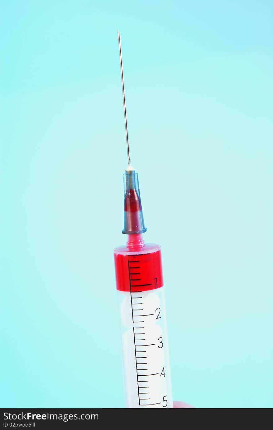 Photo of Medical Syringe on blue  background