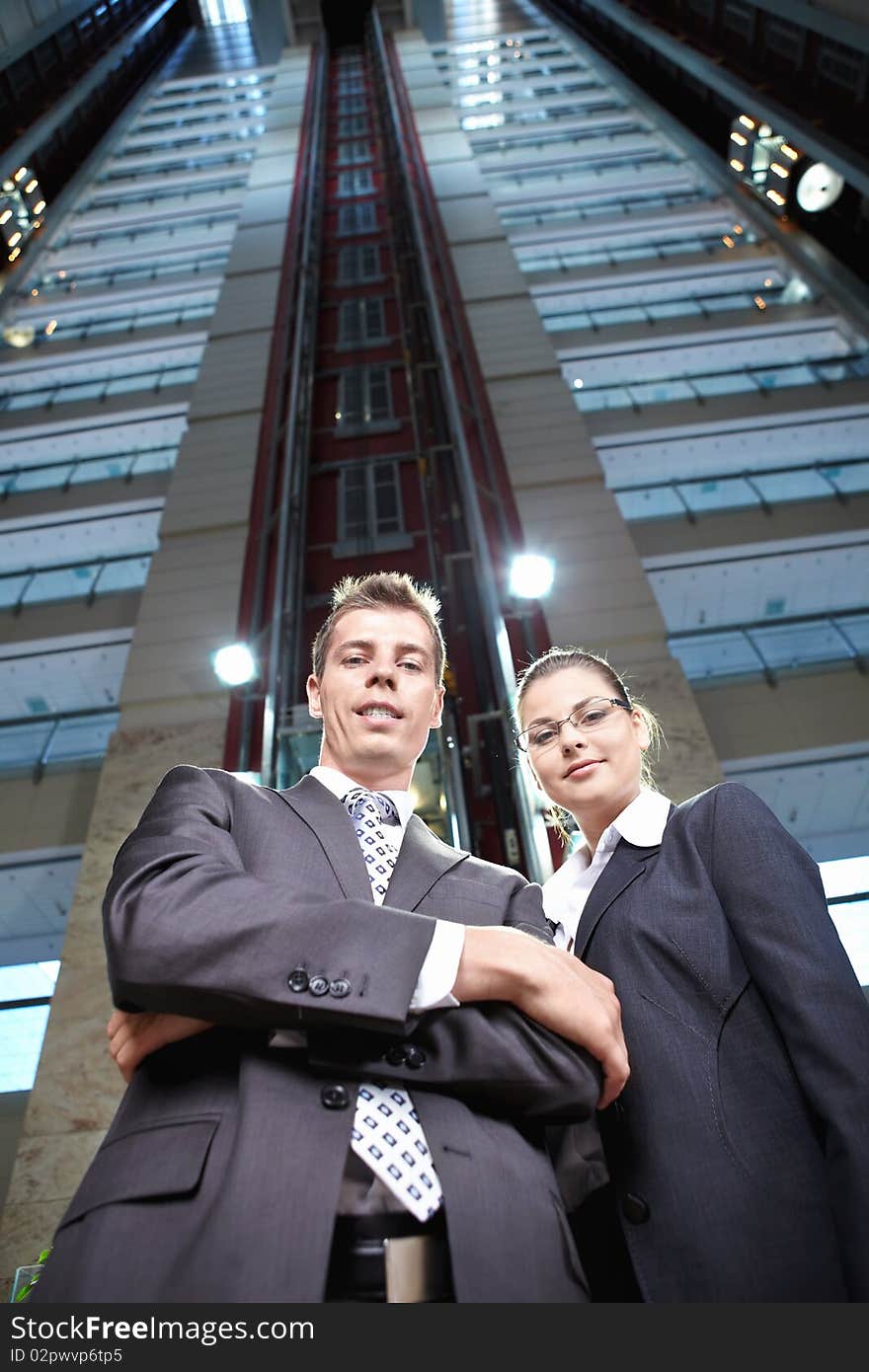 Young people in business suits on the background of the building