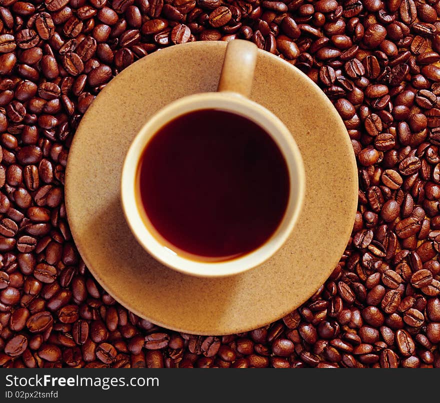 Fragrant Fried Coffee Beans A-smoke And Cup