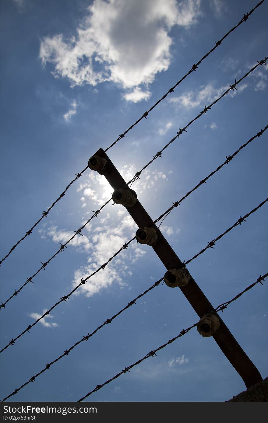 Barbed wire and sunlight in Mathausen. Barbed wire and sunlight in Mathausen