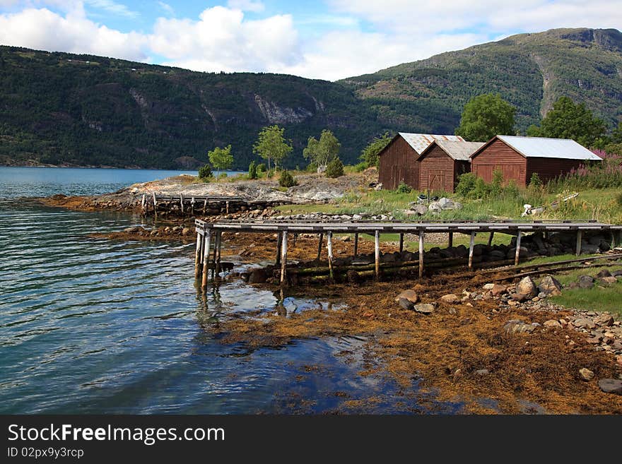 Old wooden pier and the boathouses