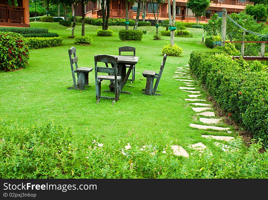 A chairs and a table in a garden. A chairs and a table in a garden