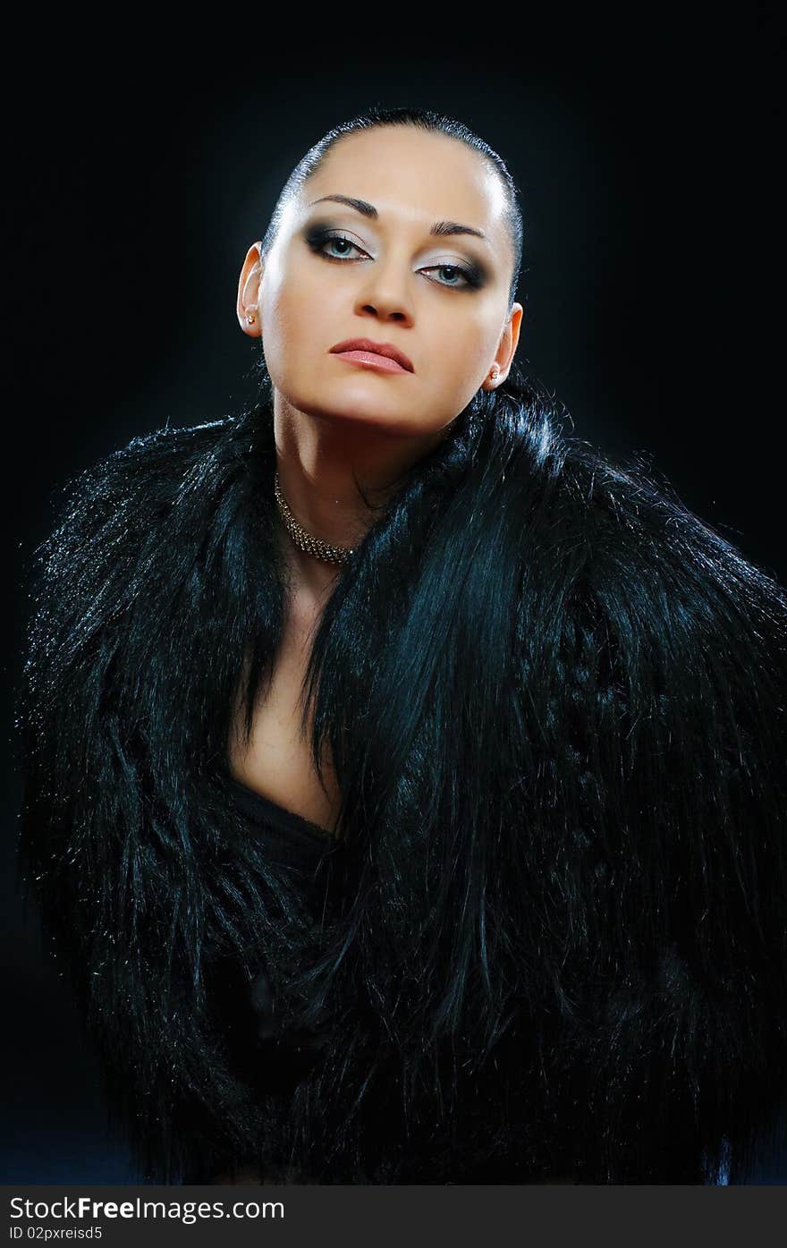 Portrait of brunette in black fur coat. Portrait of brunette in black fur coat