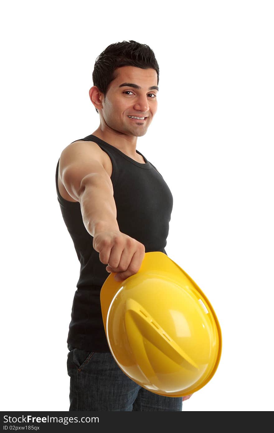 A friendly construction worker, builder or tradesman takes off his hard hat and smiles.  White background. A friendly construction worker, builder or tradesman takes off his hard hat and smiles.  White background.