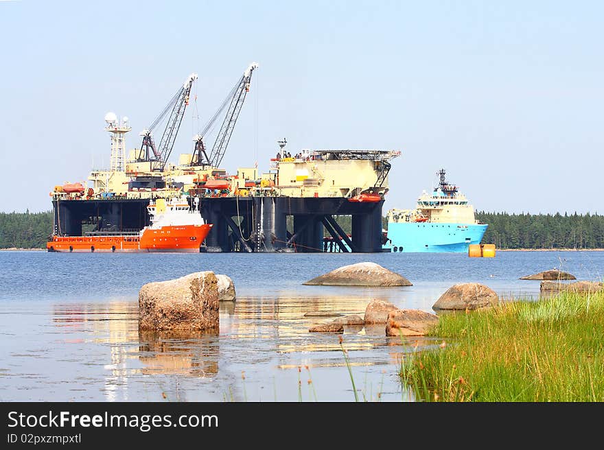 The image of floating pipelayer works at the construction of underwater pipeline