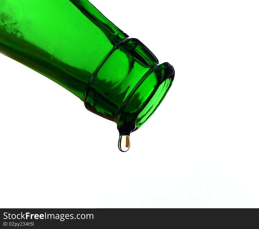 Green bottle with the last drop of beer