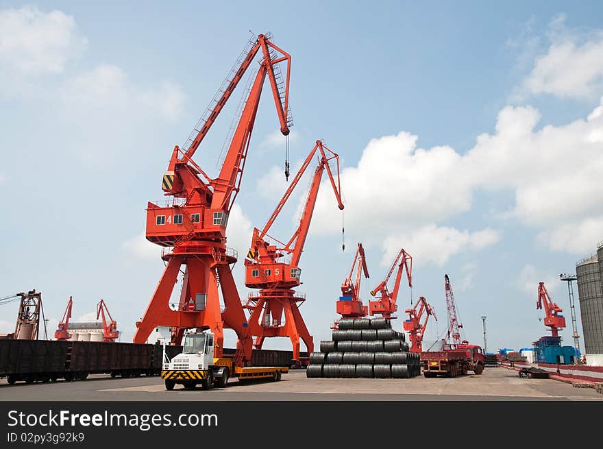 Mang cranes against blue sky，which taken in Qingdao Port China. Mang cranes against blue sky，which taken in Qingdao Port China