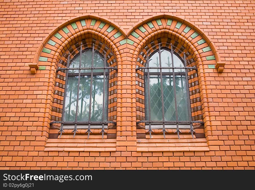 Red Bricks Church, brick wall, design windows, old building in Czech Republic, Breclav. Red Bricks Church, brick wall, design windows, old building in Czech Republic, Breclav