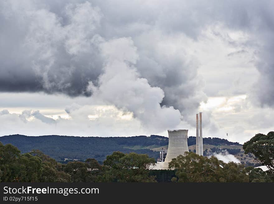 Clouds of polluting gasses being pumped into the sky. Clouds of polluting gasses being pumped into the sky