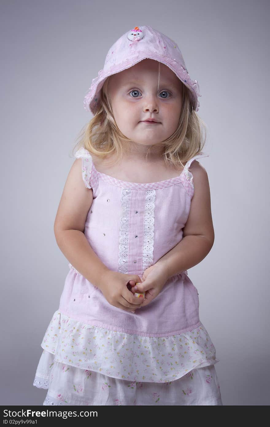 Cute portrait of little girl in pink dress. Cute portrait of little girl in pink dress