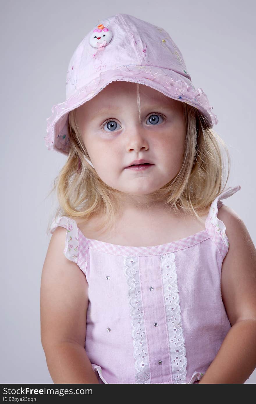 Innocent looking little girl portrait with cute hat. Innocent looking little girl portrait with cute hat