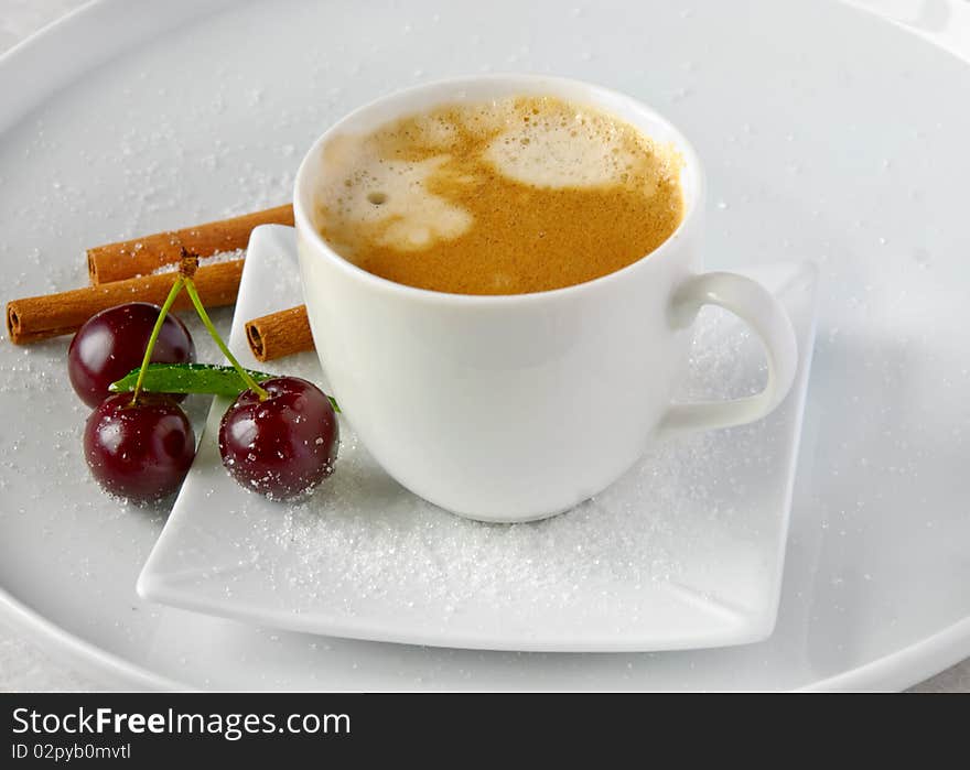 Coffee cup ,cinnamon and cherries. Coffee cup ,cinnamon and cherries