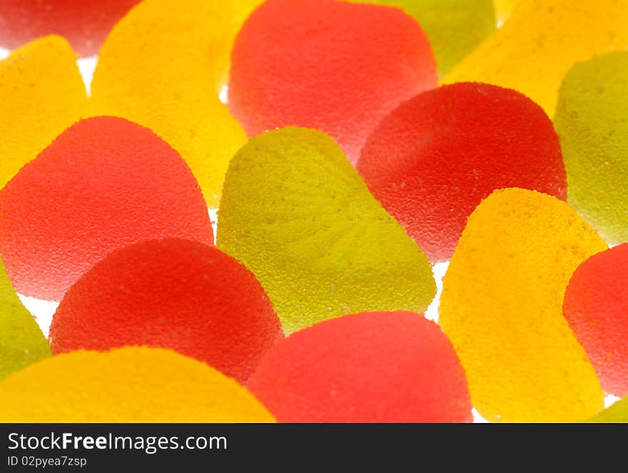 Coloured fruit candies on a white background.