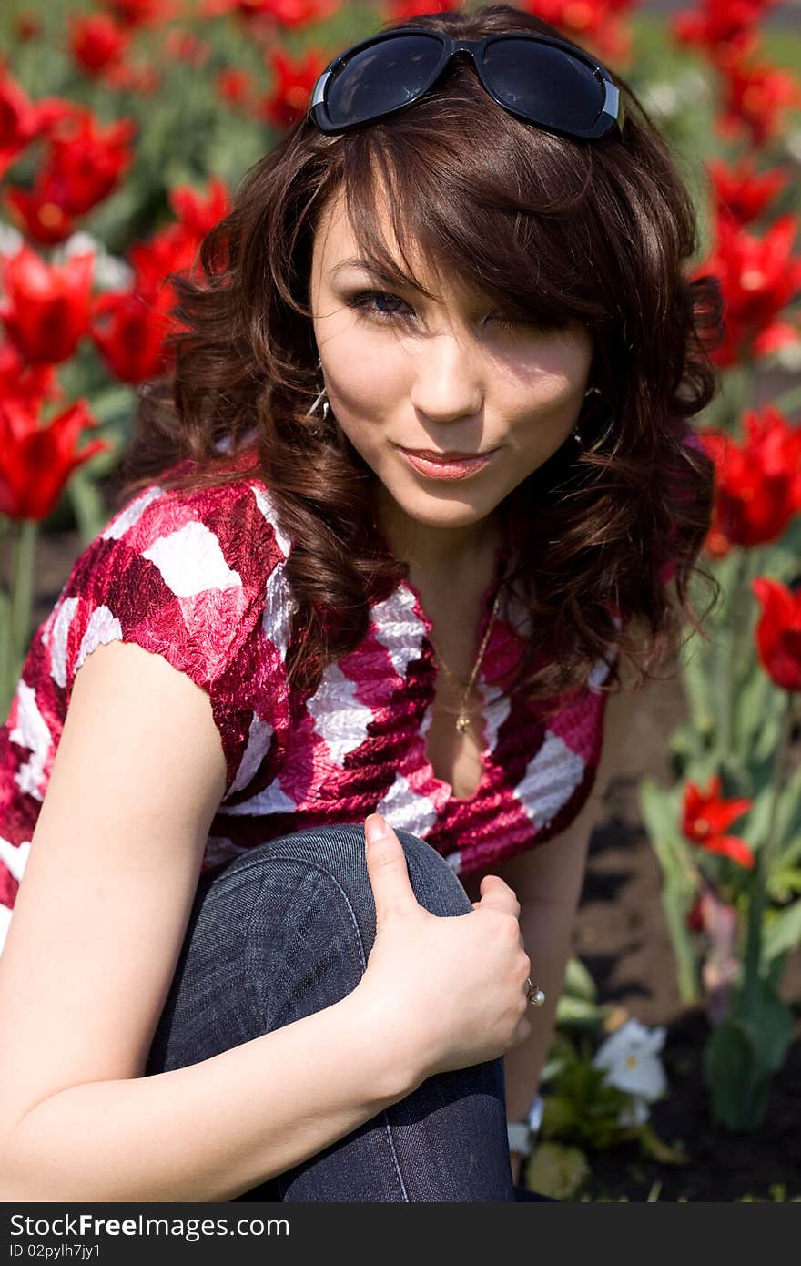 Tender girl in the garden with tulips