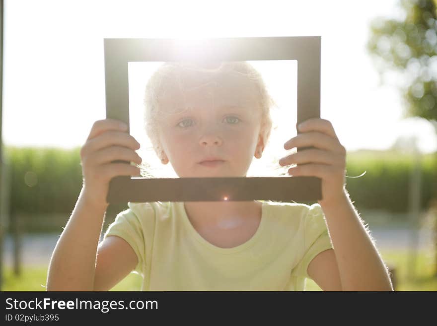 Little beautiful girl in frame. Little beautiful girl in frame