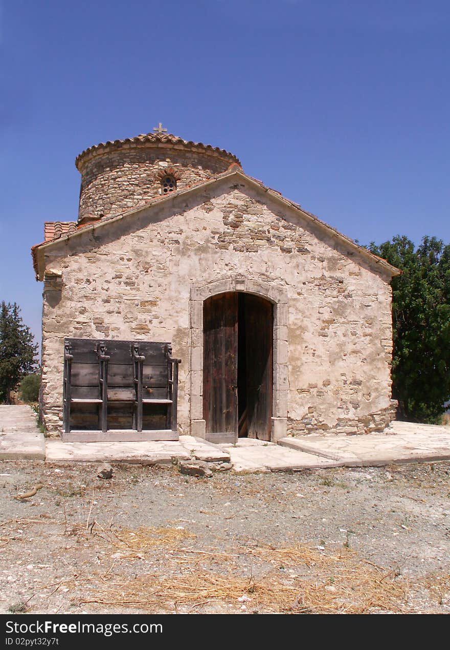 Old small stone church on a hill overlooking protaras on the island of Cyprus under blue sky. Old small stone church on a hill overlooking protaras on the island of Cyprus under blue sky