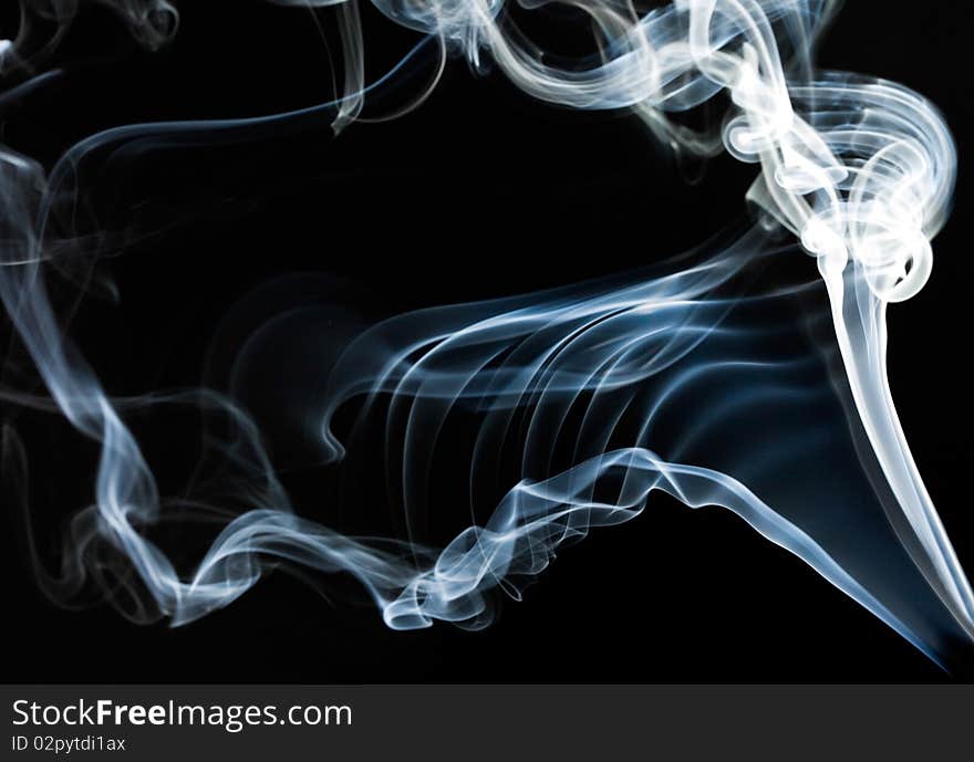 Blue smoke on black background