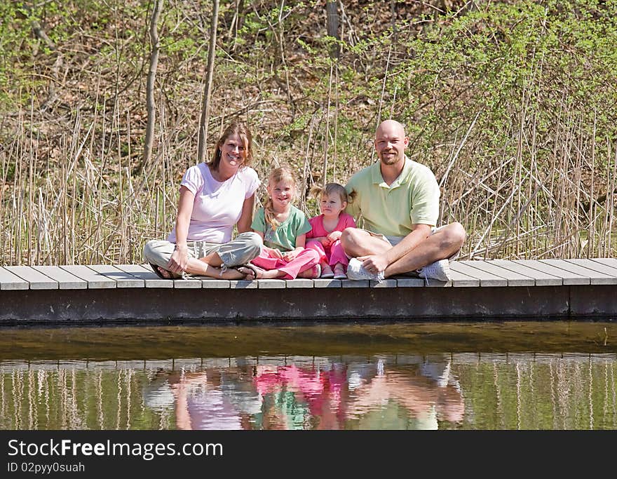 Family of Four Having Fun at the Lake. Family of Four Having Fun at the Lake