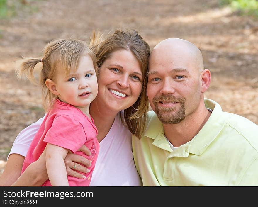 Couple With Their Daughter at the Park. Couple With Their Daughter at the Park