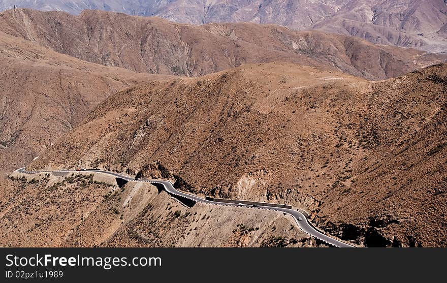 Yellowish mountain road view in tibet of China