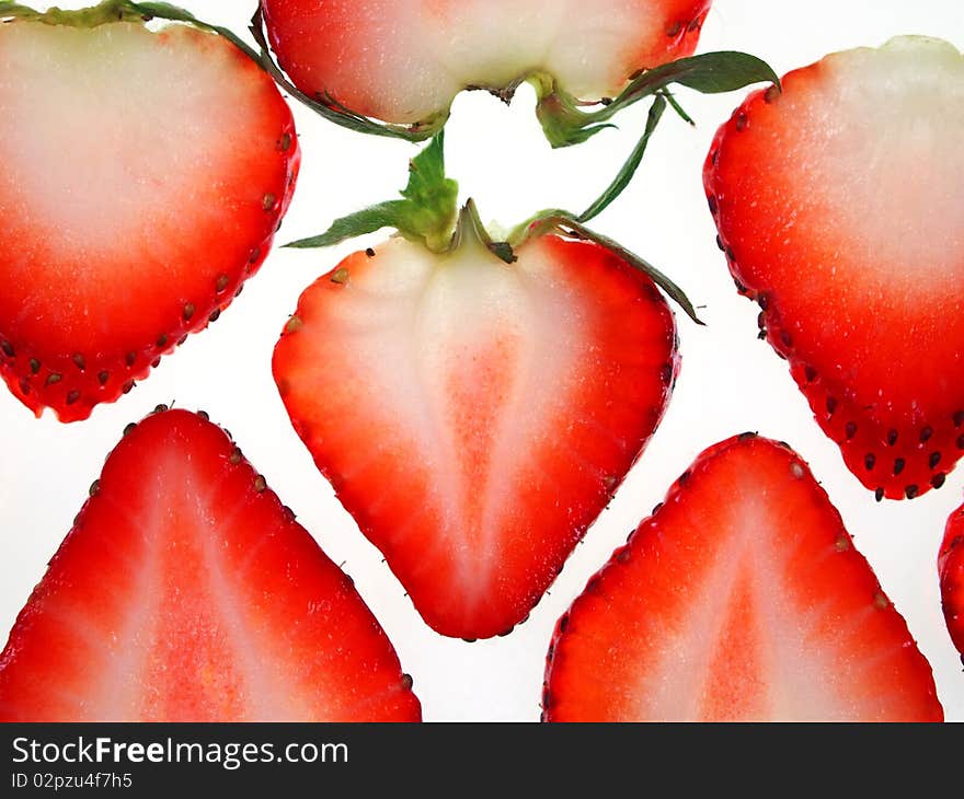 Beautiful sliced strawberries isolated on white