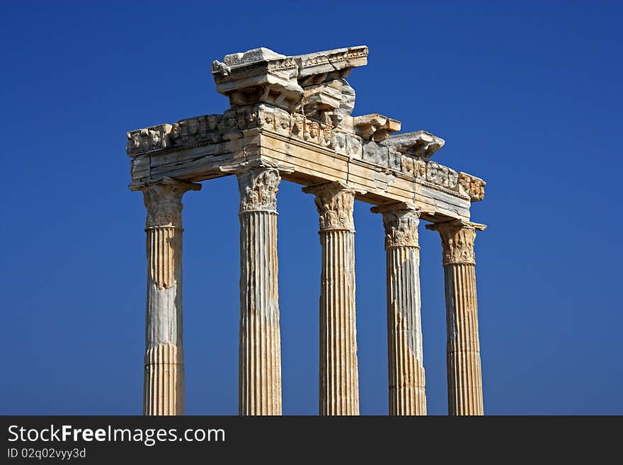 Apollo temple ruins in Side Turkey on a deep blue sky background. Apollo temple ruins in Side Turkey on a deep blue sky background