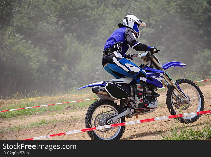 The motorcycle driver during race. The motorcycle driver during race