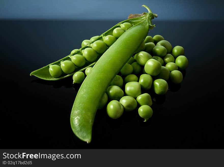 Green peas on black