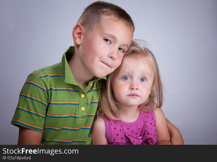 Two beautiful kids, brother and sister, in photo studio. Two beautiful kids, brother and sister, in photo studio