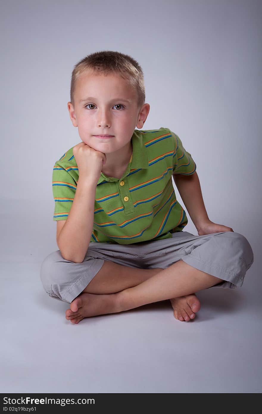 Young caucasian child in a photo studio. Young caucasian child in a photo studio