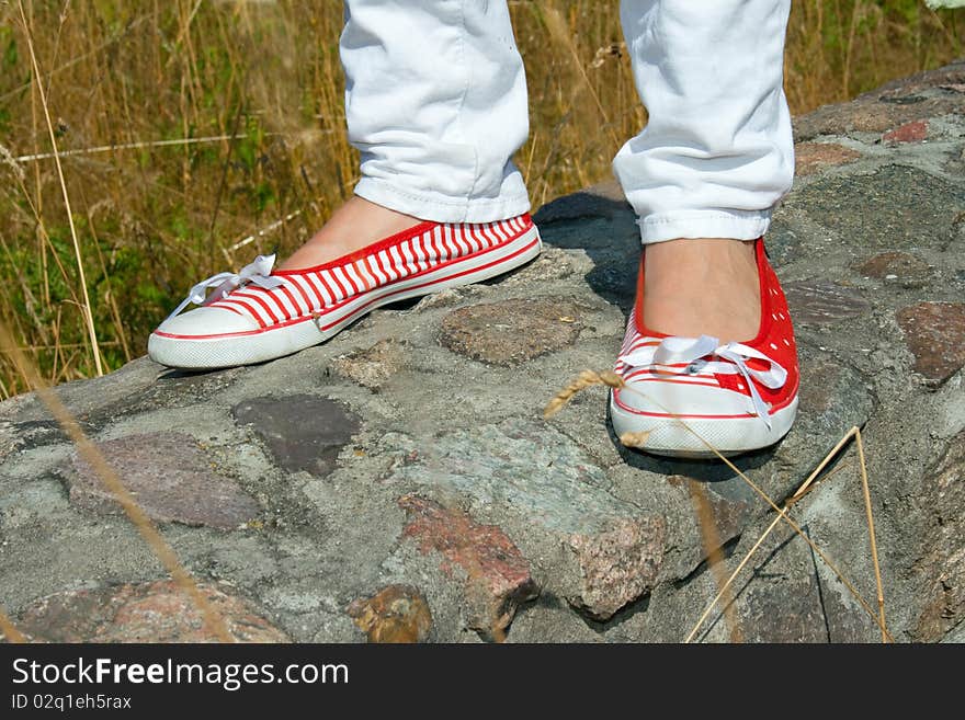 Shoes on a stone wall. Shoes on a stone wall