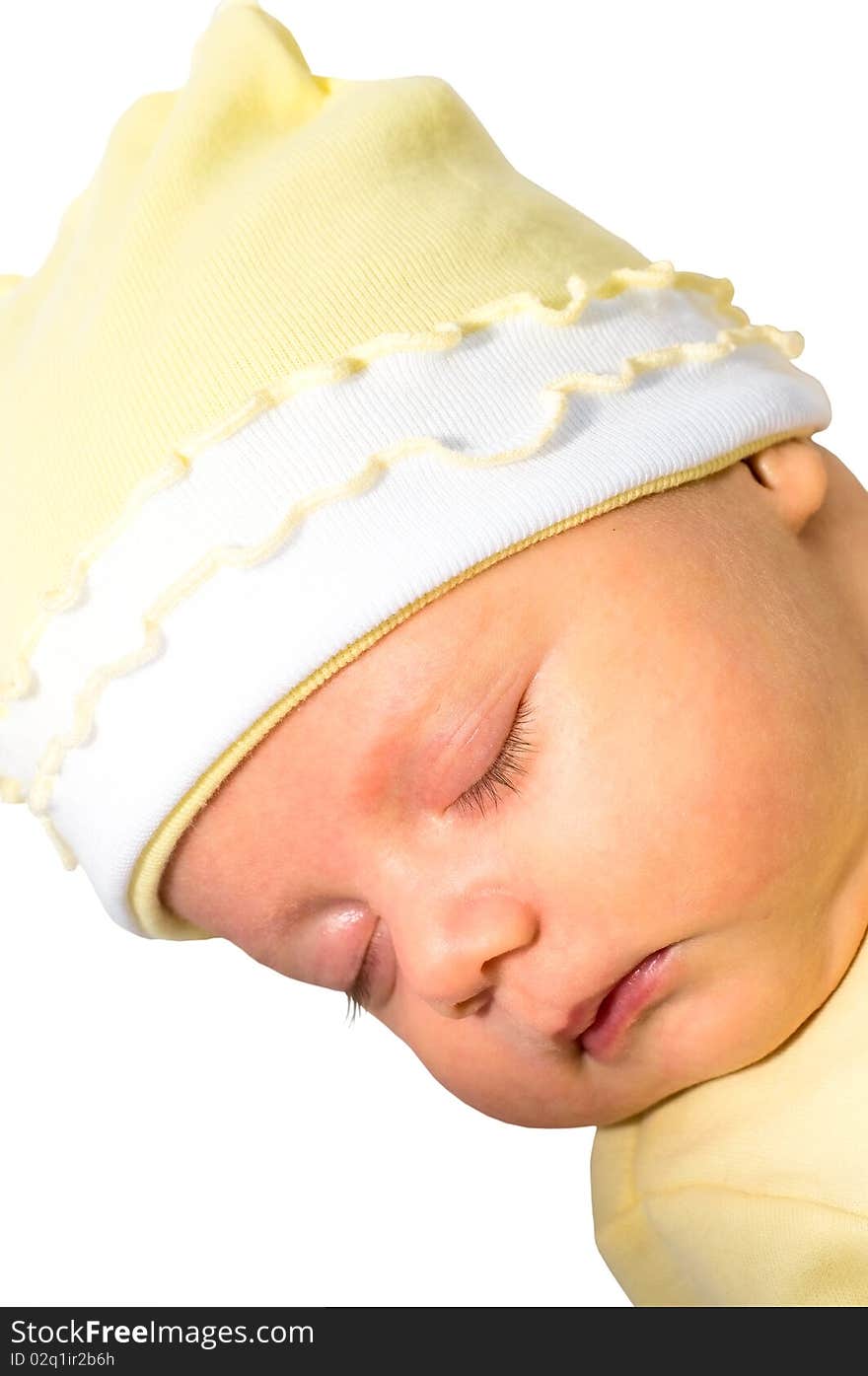 Close-up image of sleeping infant in yellow hat. Close-up image of sleeping infant in yellow hat