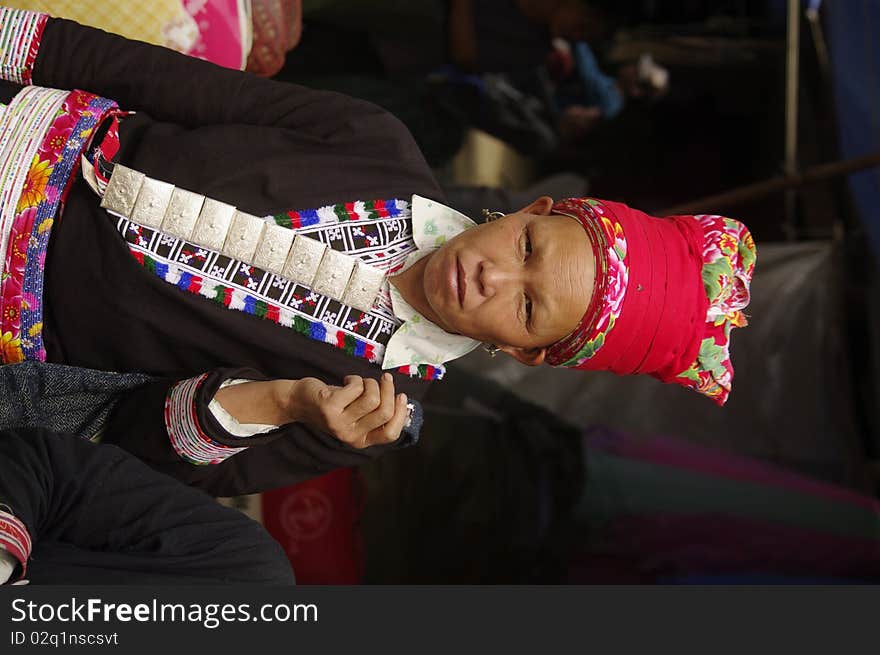 Portrait of a Woman Red Dao ethnic group in Muong Hum market, northern Vietnam near the Chinese border. Portrait of a Woman Red Dao ethnic group in Muong Hum market, northern Vietnam near the Chinese border