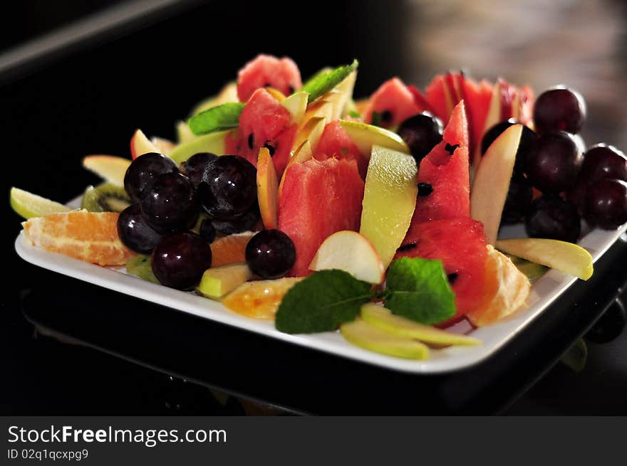 Isolated fruits on white plate