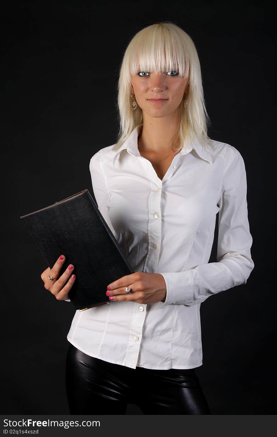 Beautiful business blonde lady looks at you with folder