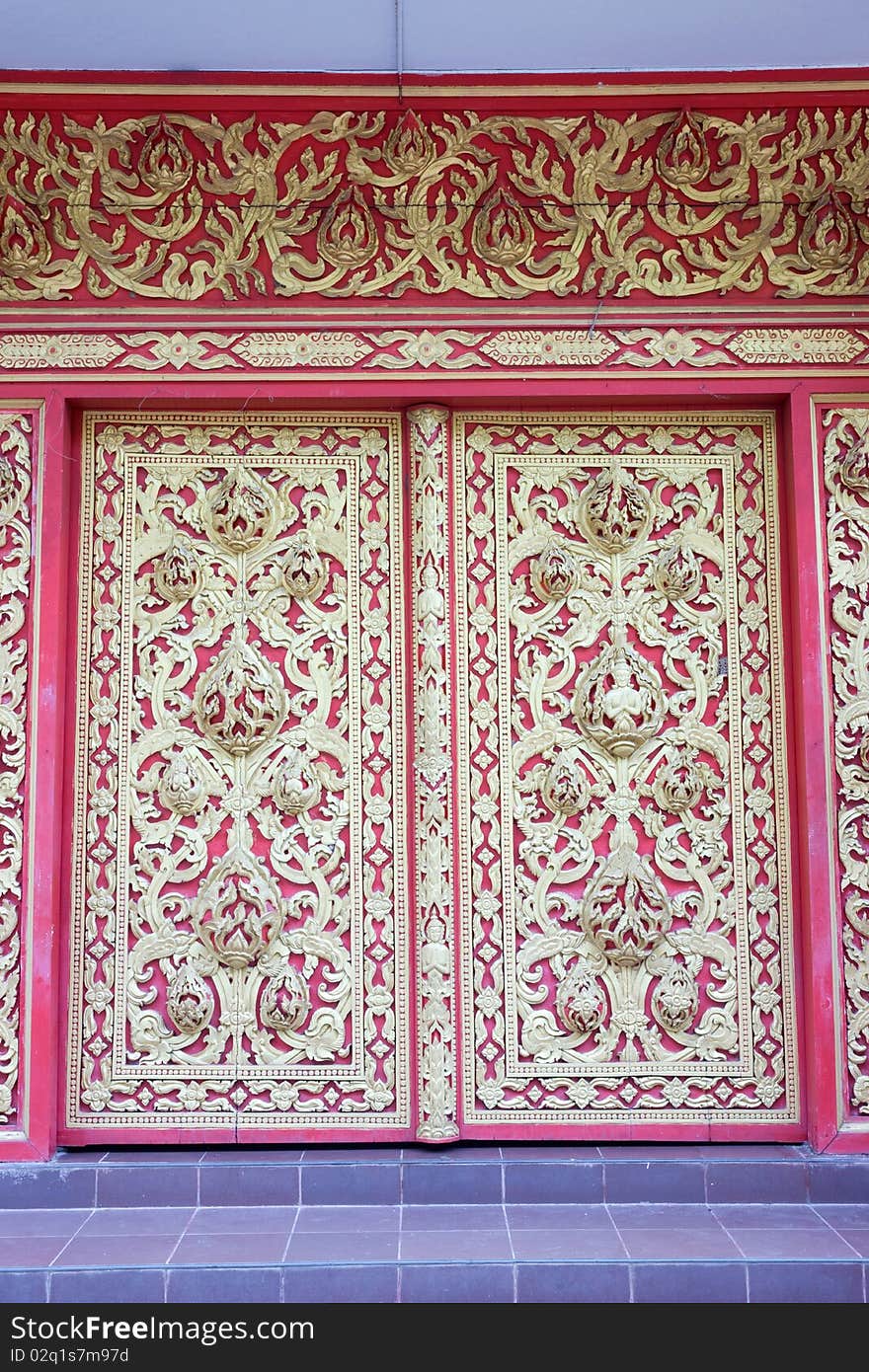 Thai style molding art at the door in the temple,Thailand