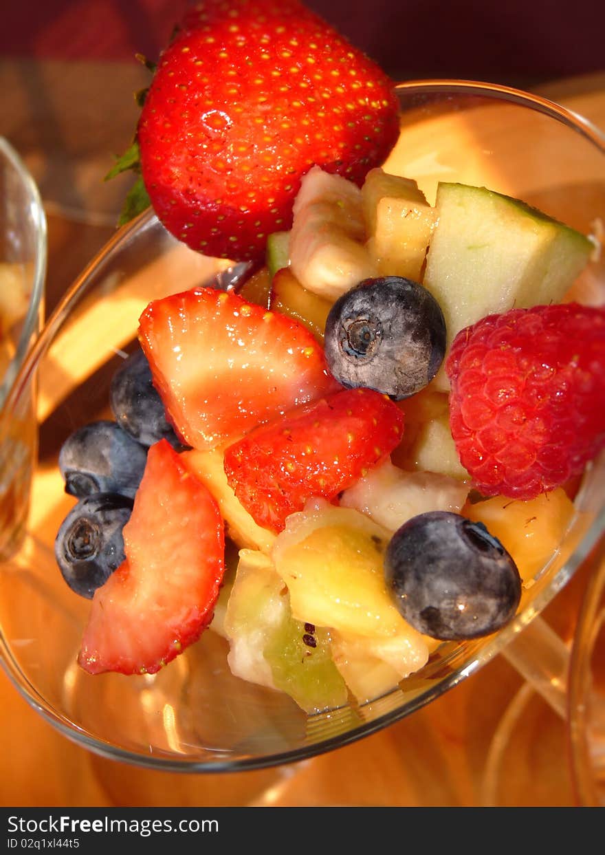 Multicolored fresh summer fruit-dessert closeup. Multicolored fresh summer fruit-dessert closeup