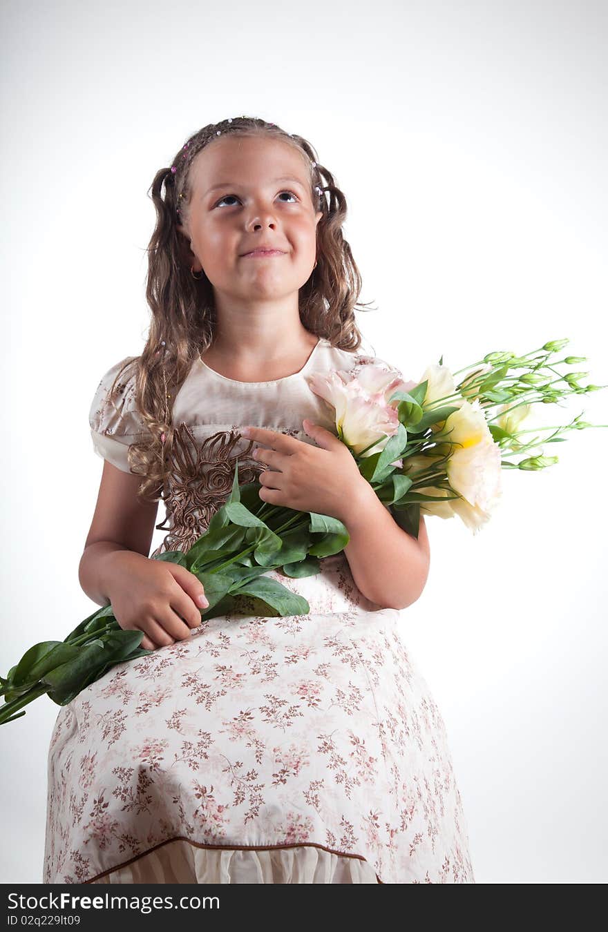 Little girl with flowers, studio shot