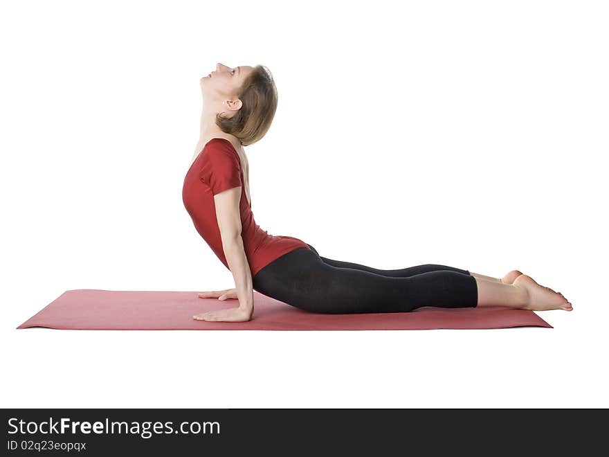 Woman exercising on a mat over white background. Woman exercising on a mat over white background