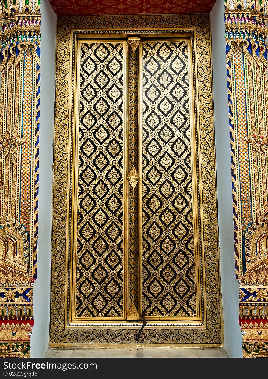 Thai church close door with gold painting