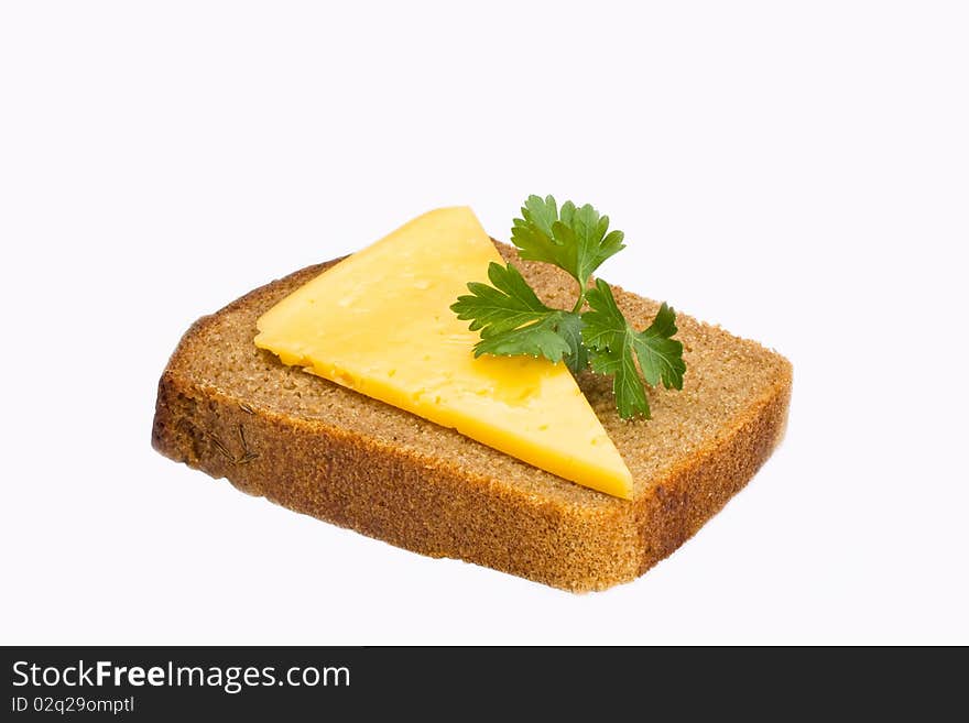 Chunk of rough bread with a cheese slice