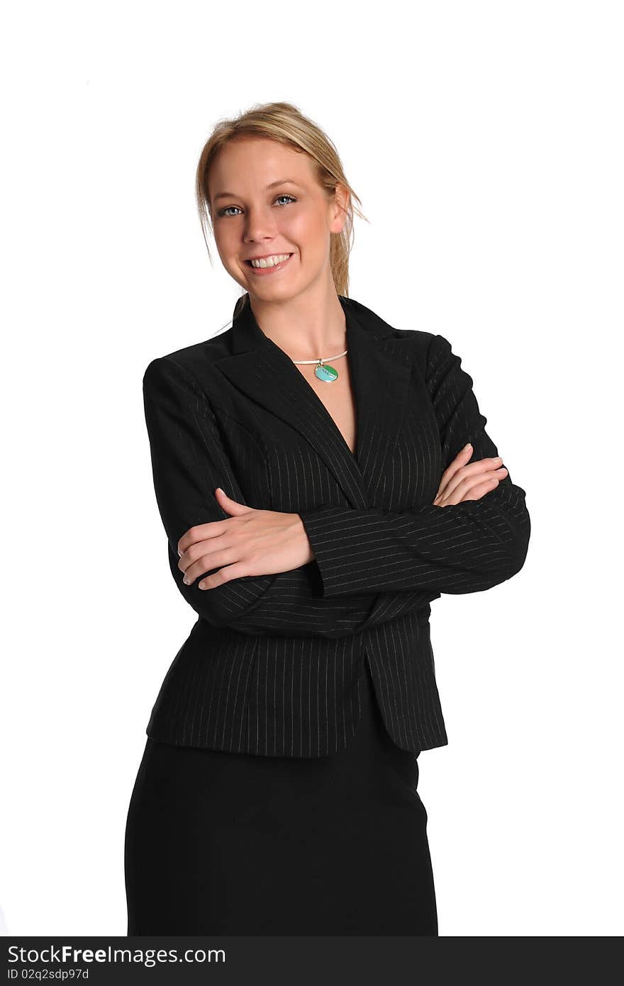 Young businesswoman smiling and with arms crossed on a white background