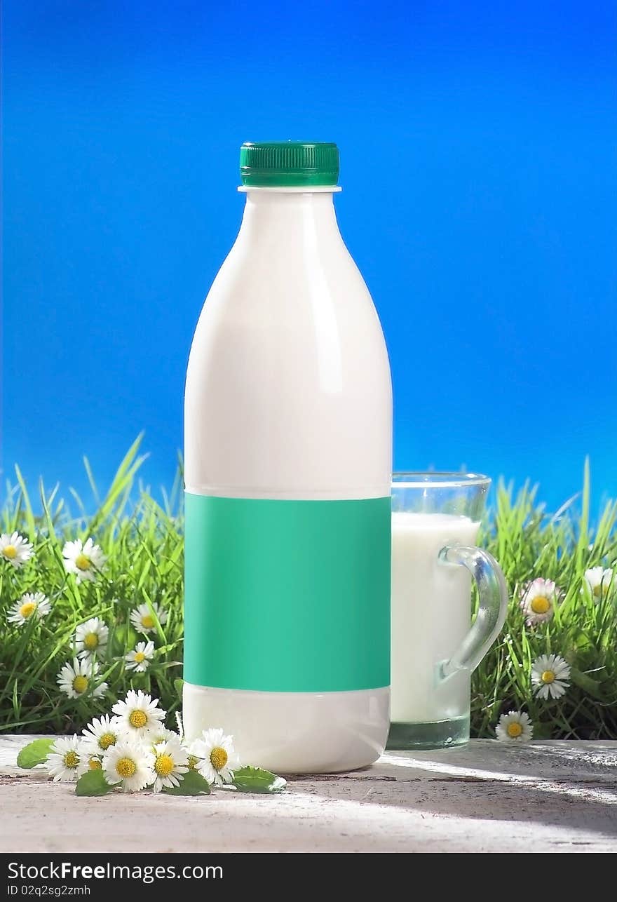 Milk bottle and glass outside