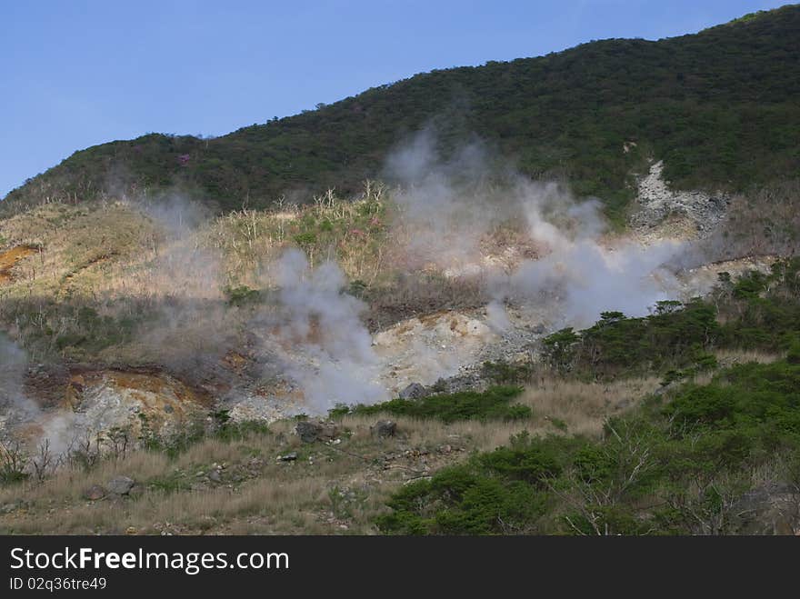 Hakone, Japan. The smelly hot steam is coming from underground thermal springs. Hakone, Japan. The smelly hot steam is coming from underground thermal springs