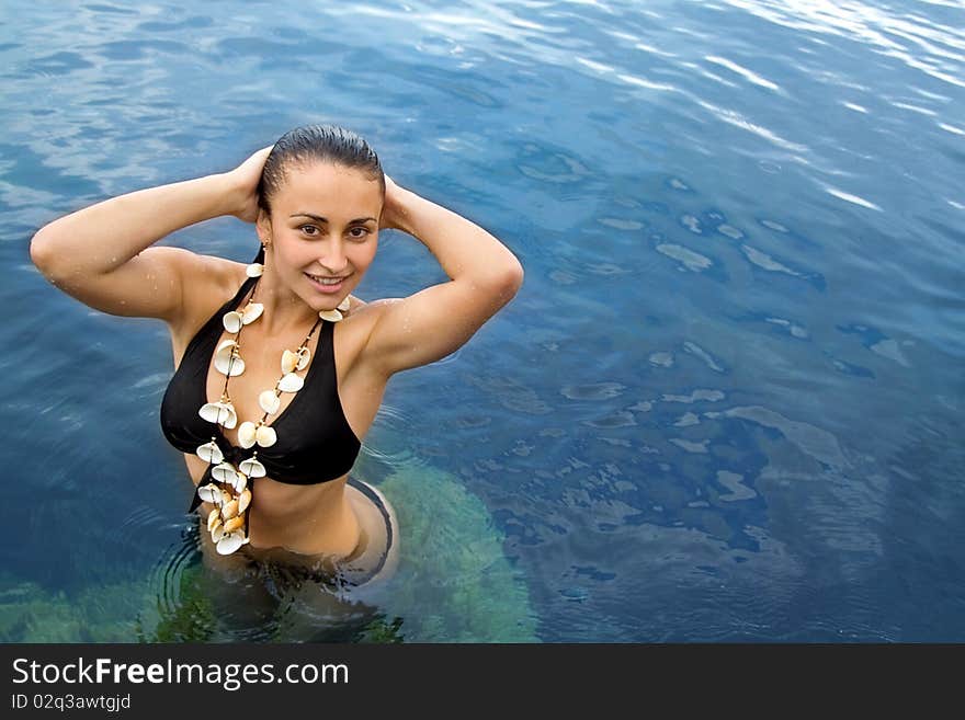 Happy Girl Standing In The Sea