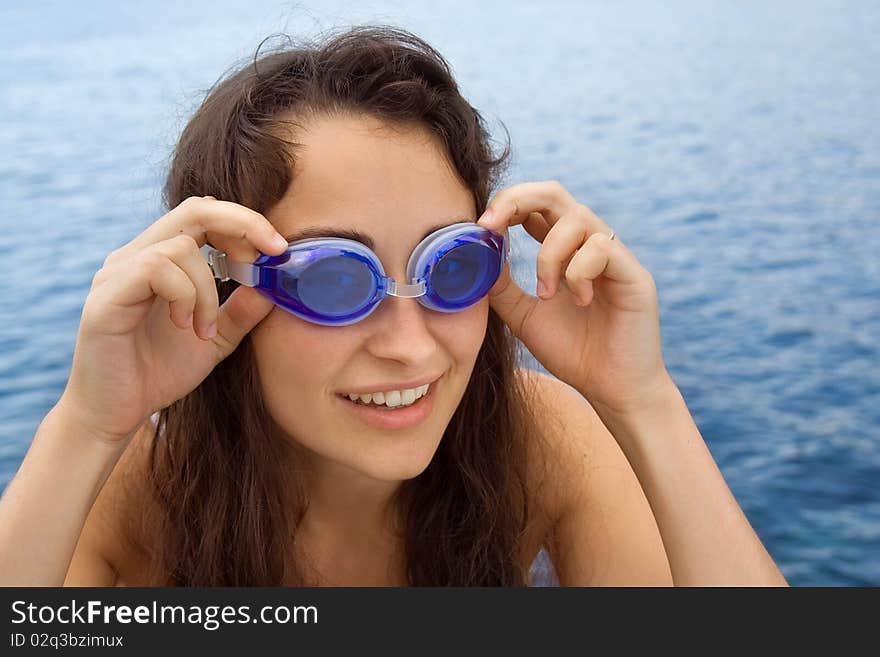 Young girl with swimming glasses