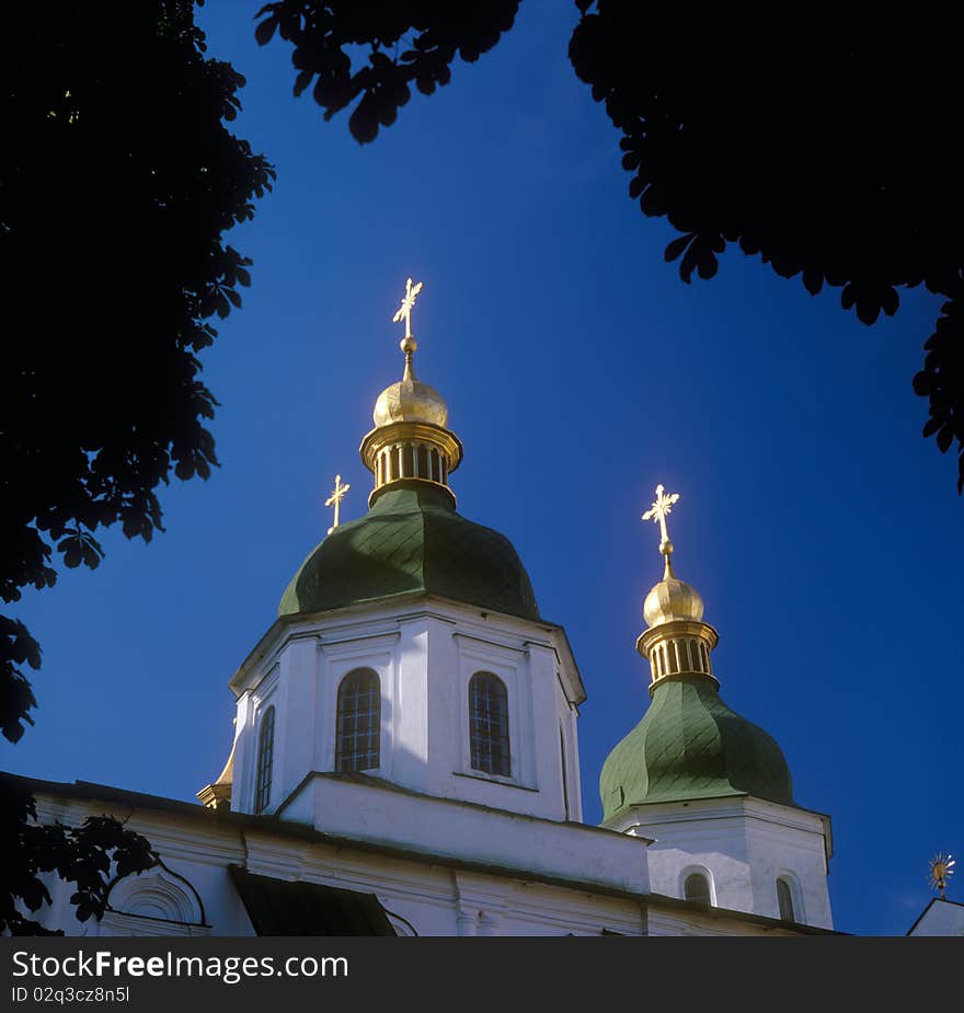 Gold domes of St. Sophia cathedral against blue sky. Kyiv, Ukraine. Gold domes of St. Sophia cathedral against blue sky. Kyiv, Ukraine.