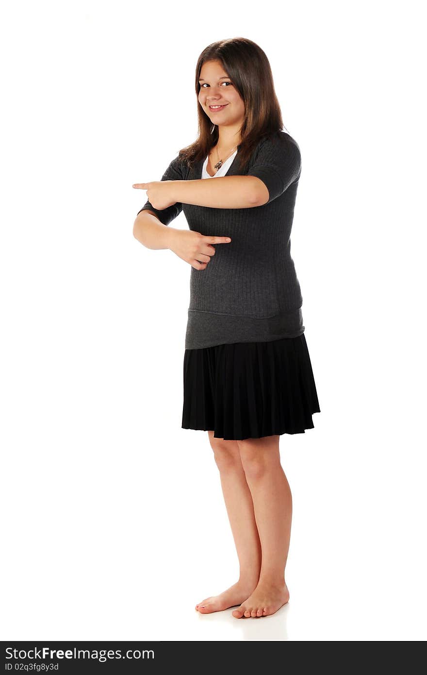 A happy, barefoot young teen pointing in opposite direcctions with both hands. Isolated on white. A happy, barefoot young teen pointing in opposite direcctions with both hands. Isolated on white.