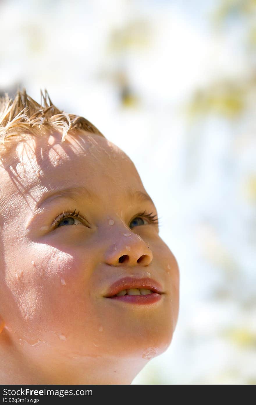 Young child with water drop on face. Young child with water drop on face